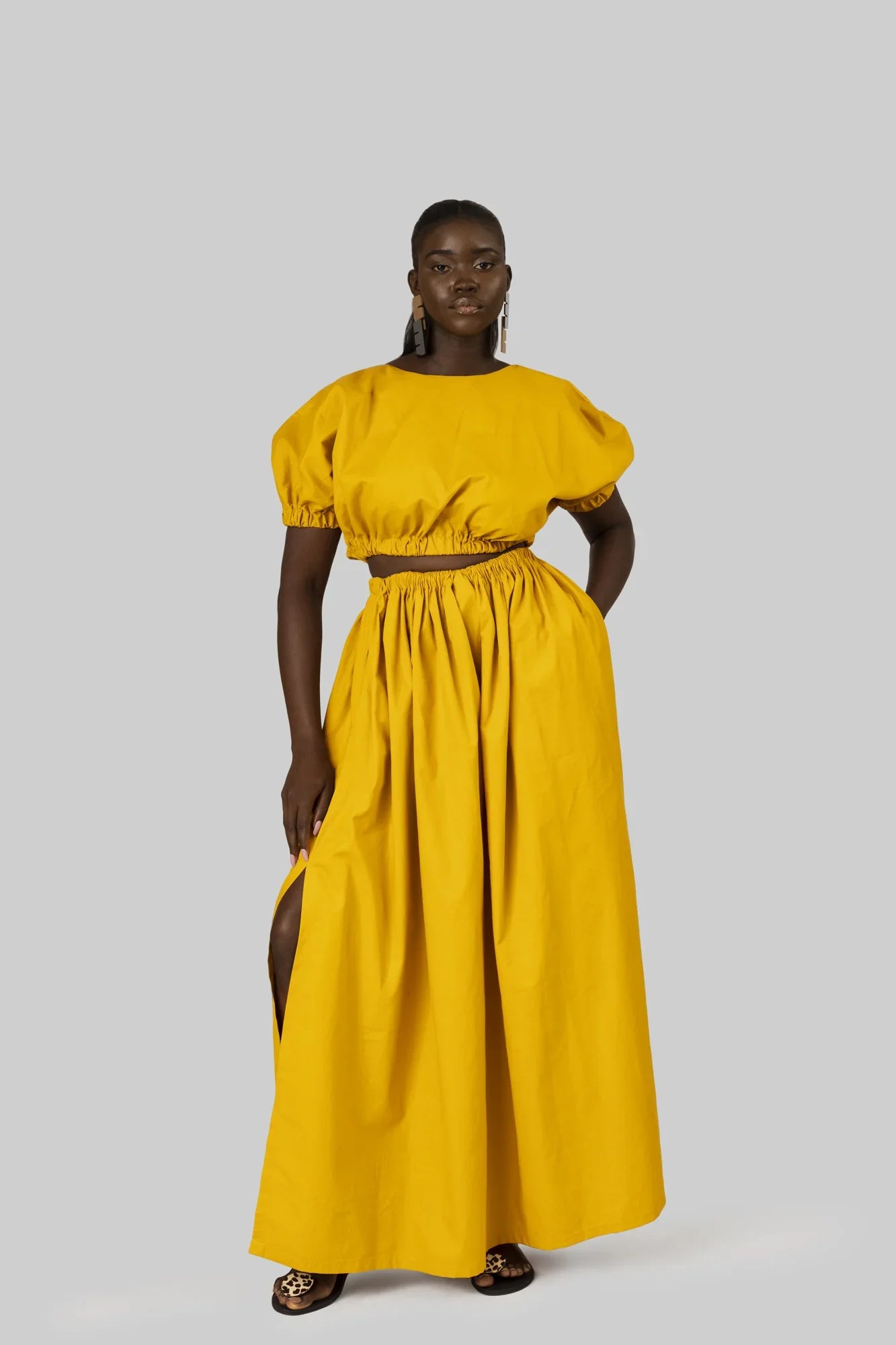 M.O.T Nunu set, Cropped blouse & Maxi skirt with side slits Chic Off-Shoulder Blouse M.O.T Nunu set, Cropped blouse & Maxi skirt with side slits Chic Off-Shoulder Blouse